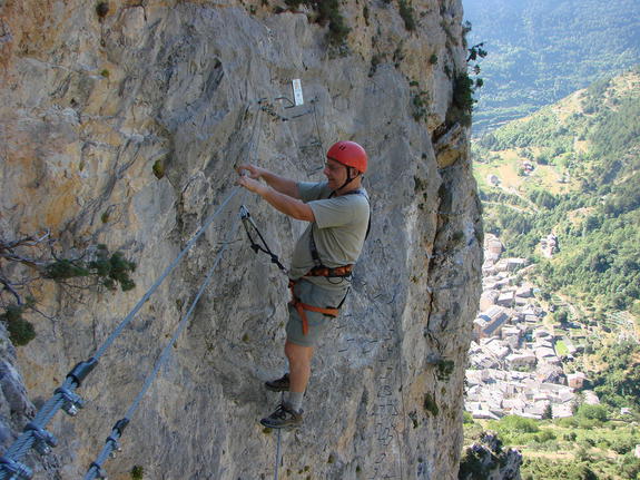 Climbing rock faces for via ferrata in Roya valley, Tende